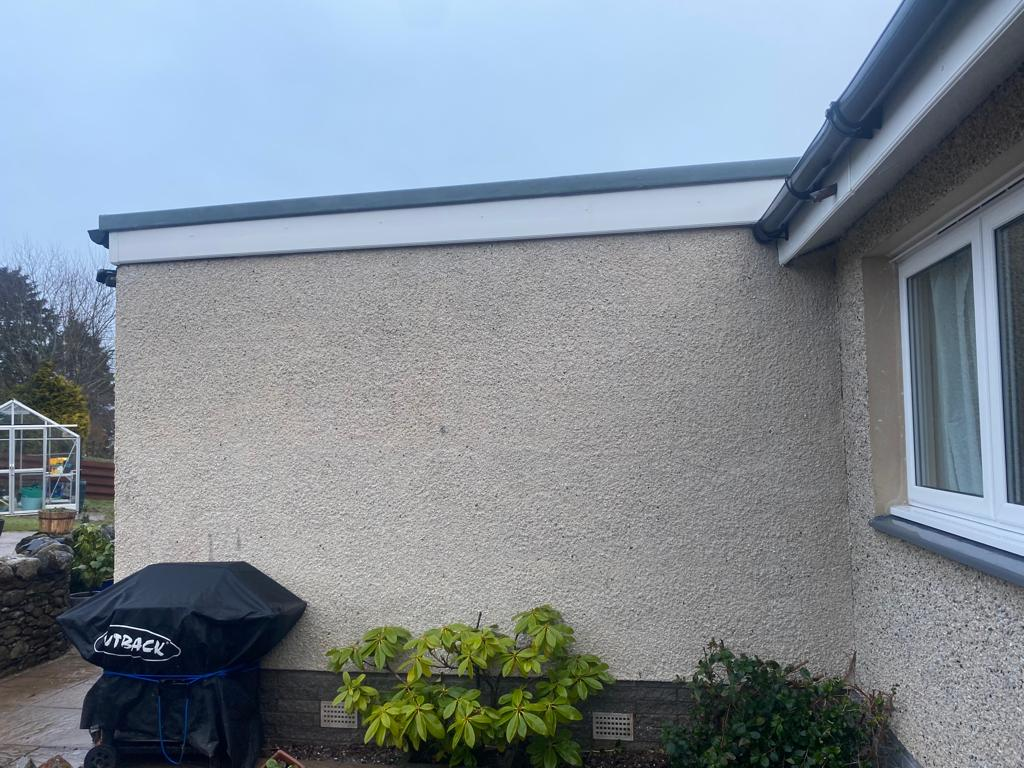 Rendered exterior wall before cleaning by Noble Exterior Cleaning