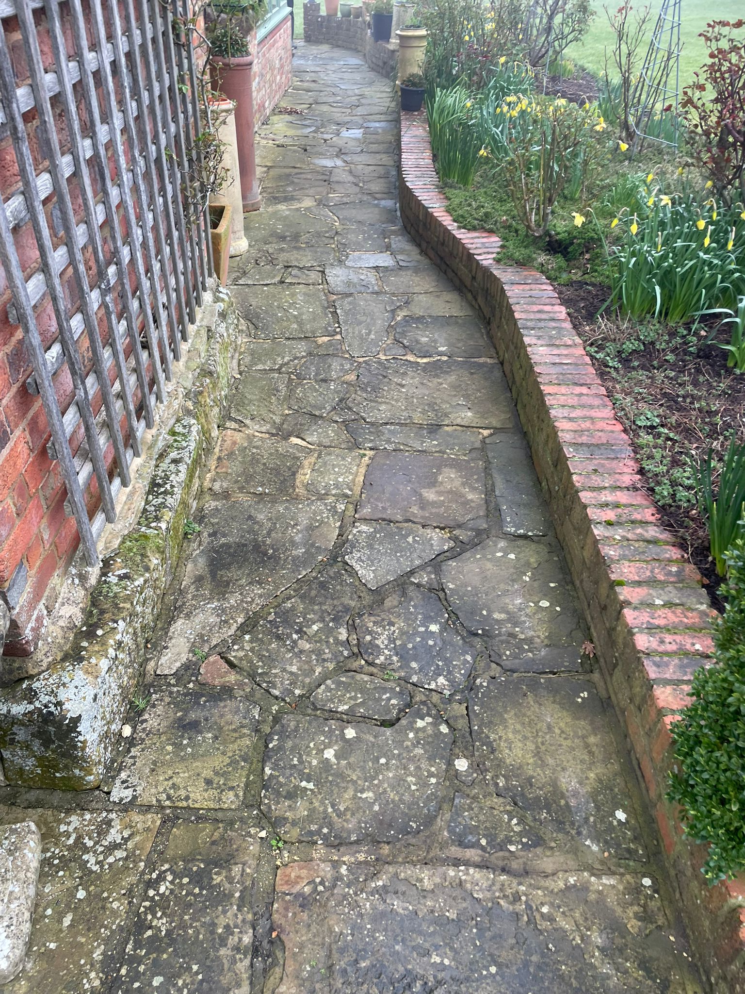 Patio paving before cleaning by Noble Exterior Cleaning